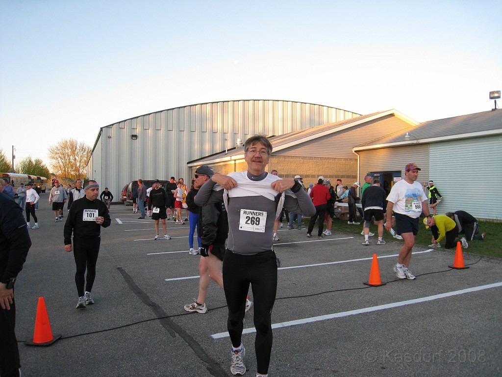 Mackinaw Bridge Race 2008-05 0182.jpg - Okay, not flashing, just showing the number for the race. Since the temperature was a balmy 38 degrees when the race started I wore a second shirt. At mile 1 I wished I had also worn gloves! The second shirt was a good idea until about mile two when a cooler solution would have been okay with me!